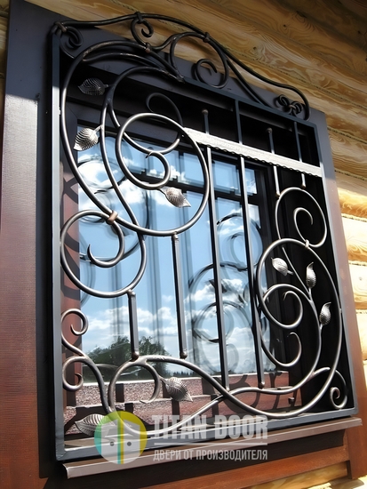 Стальная фигурная решетка на окно кованого типа с листвой Стальная фигурная решетка на окно кованого типа с листвой